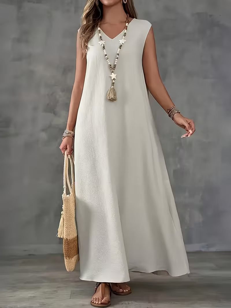 Robe longue blanche subtile — Vogue Française