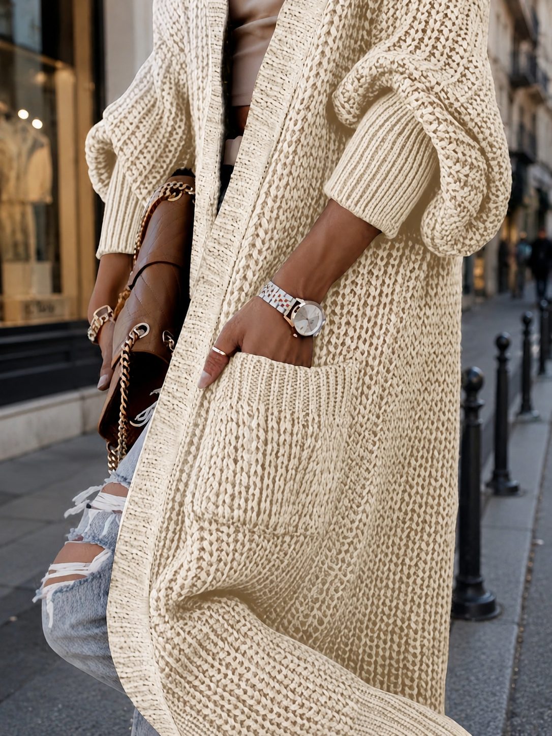 Cardigan long Rivoli en maille oversize, à poches — Vogue Française